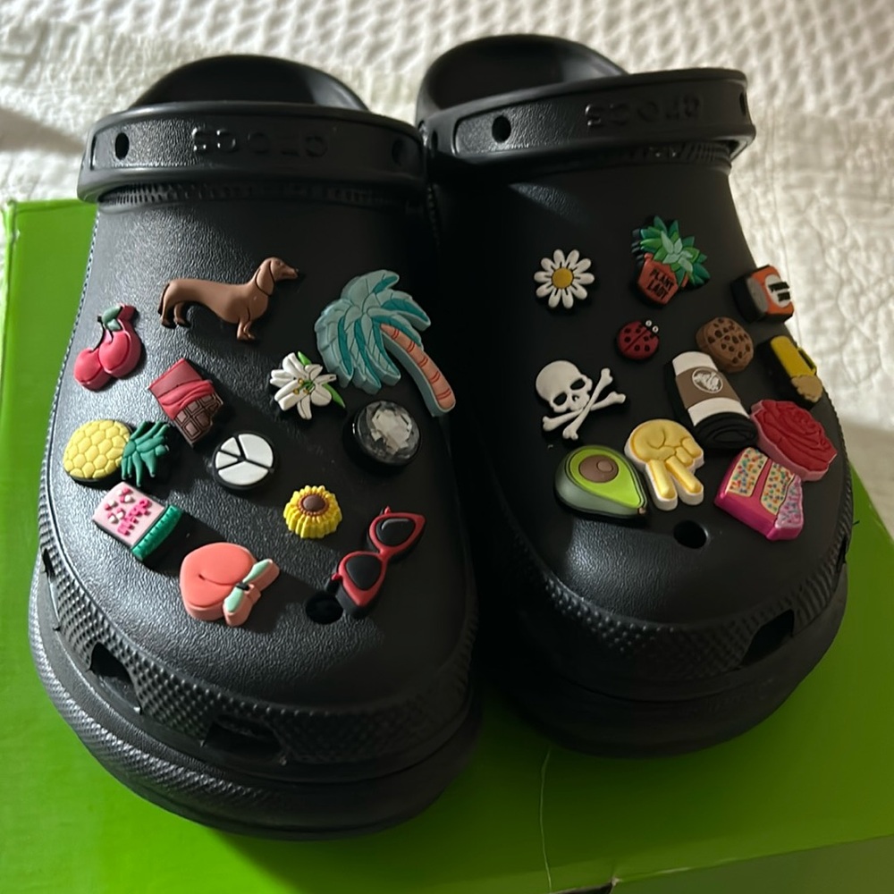 Crocs classic bae clog in black size 8 loaded with jibbitz.